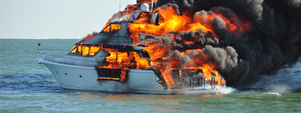 A yacht on fire in the water